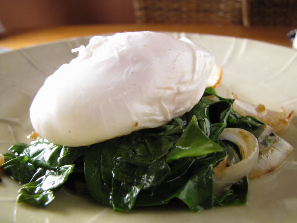 2 poached eggs over wilted spinach make a healthy breakfast.